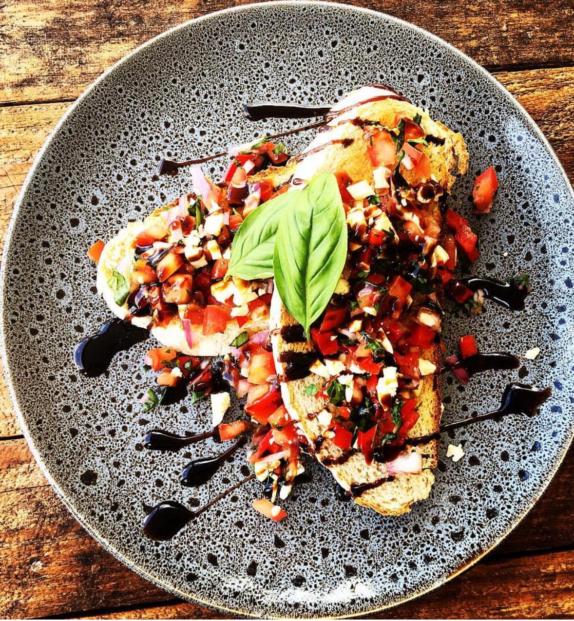 The Steaming Cup Cafe - Cozy interior with warm lighting